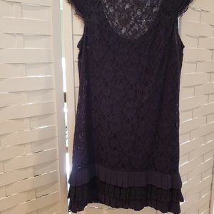 Jessica Simpson able-black lace dress with pleated hem details.  Low back.